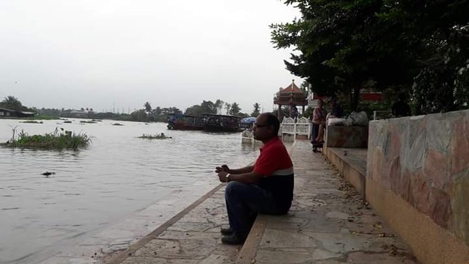 ThaChin River, Thailand. Sometimes prefer to sit with the rivers alone. By that way one can feel the riverine spirit better. This place, Lam Phaya, is plused by a Buddhist temple on the bank. Devotees feed the fishes in the 'Fish Park'. Solemn silence!