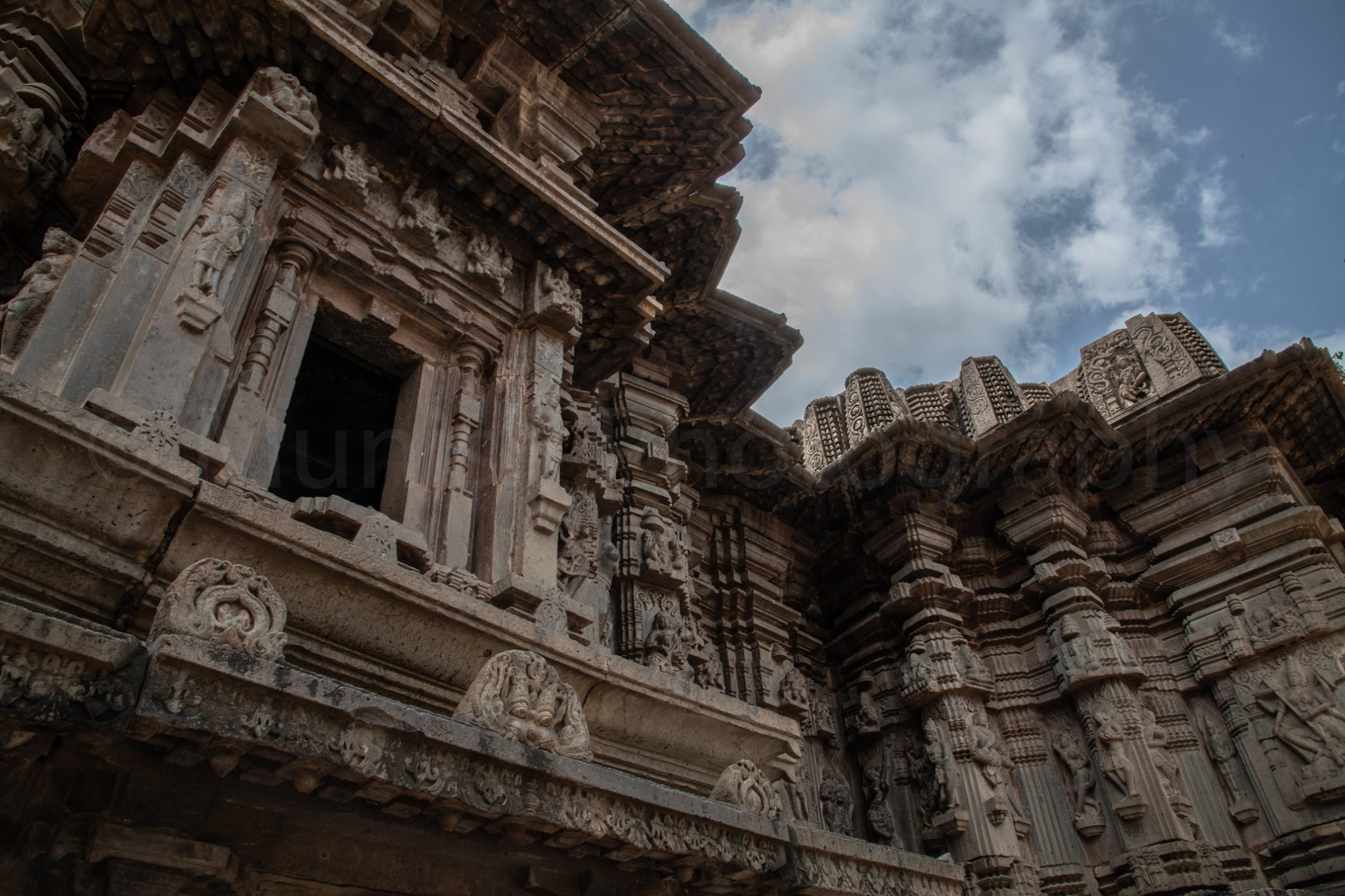 Stone carved pillars form the surroundings of the interior.