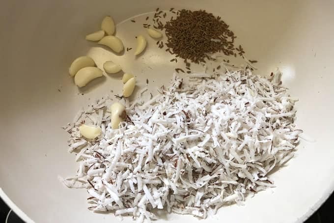 Dry roast the ingredients for Dry Roasting in a pan until slightly browned. Remove on a plate and let them cool.