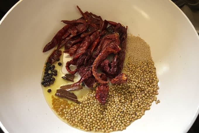 Heat ghee for ghee roasting in a pan. Roast all the ingredients listed under ghee roasting until they are nicely browned and fragrant. Remove the ingredients on a plate and let them cool.